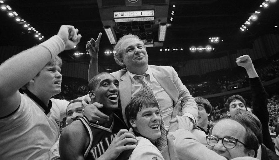 Villanova coach Rollie Massimino takes a victory ride with his players on the floor after Villanova defeated North Carolina in NCAA Southeast Regional finals, Sunday, March 24, 1985 in Birmingham. Players are Harold Pressley, left, and Brian Harrington. Villanova won 56-44. (AP Photo)