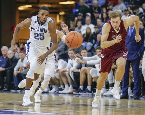 Villanova guard Mikal Bridges runs after the ball against Lafayette forward Paulius Zalys during the first half of an NCAA college basketball game Friday, Nov. 17, 2017, in Allentown, Pa.