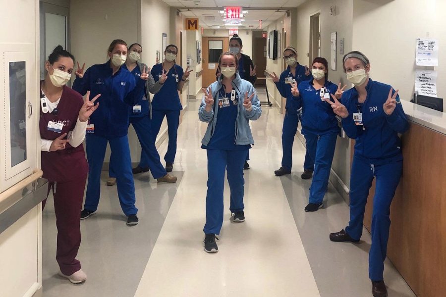 Alumni of the College of Nursing show school spirit while working in New York City hospitals. 