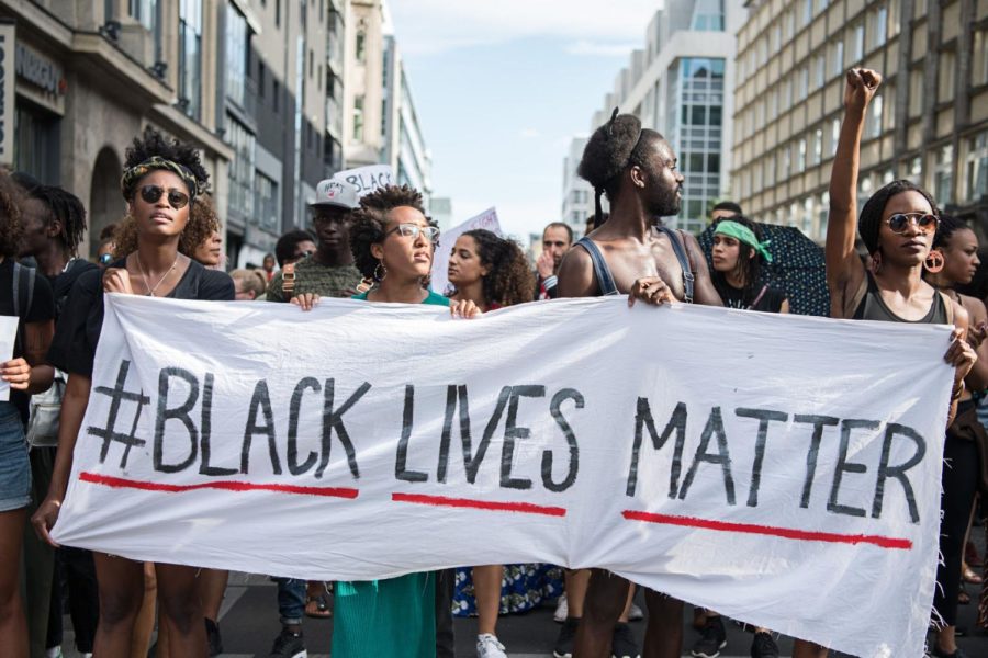Protestors hold a banner reading Black Lives Matter during a demonstration following the death of George Floyd