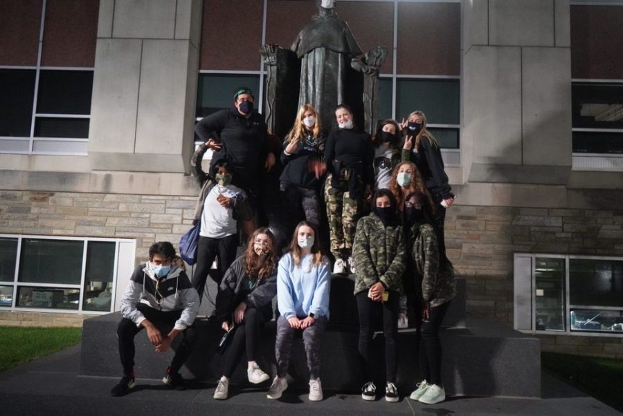 “Fam 6” poses by the Gregor Mendel statue