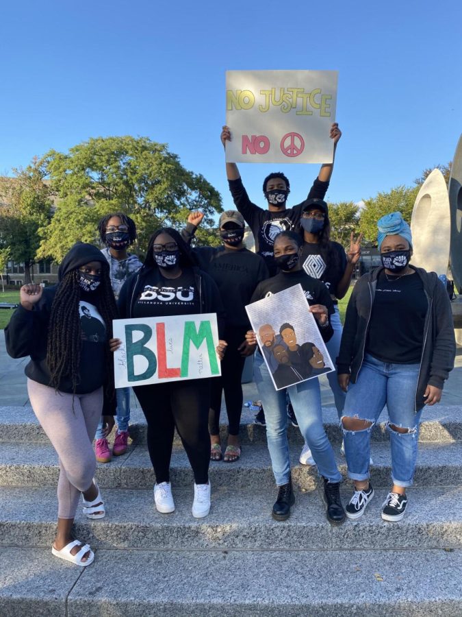 Members of Black Student Union stand at The Oreo at Friday’s protest.