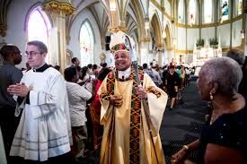 Archbishop Gregory leaving mass.