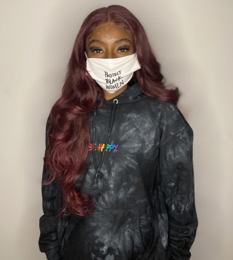 Danielle Burns shows off her mask for social justice