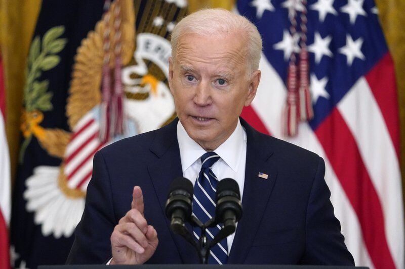 Biden speaks at the press conference.