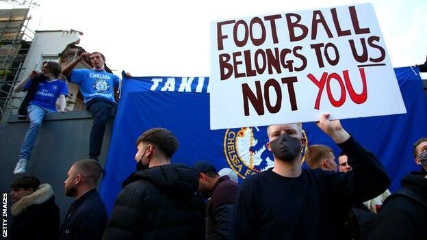 Chelsea fans protest Premier League match. 