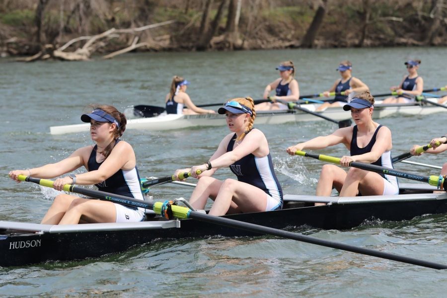 Madison Burke (front middle) is a captain on the rowing team.