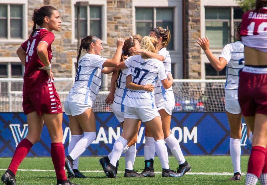 The team celebrates after scoring the opener against Colgate.