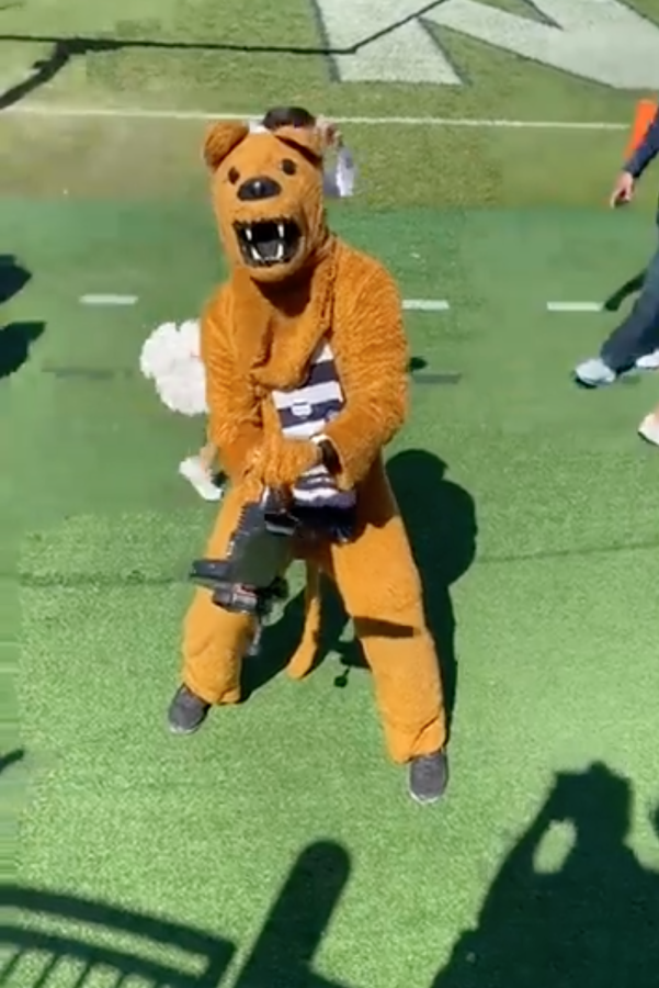 The Penn State Nittany Lion wields a leaf blower during Saturdays game.