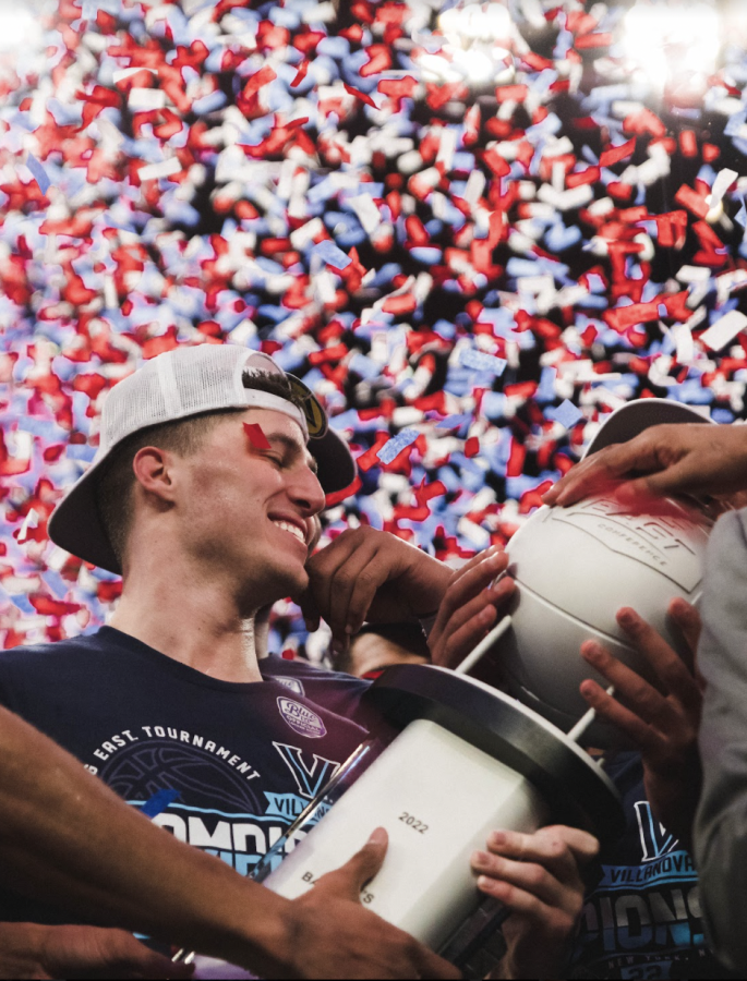 Collin Gillespie celebrates with trophy after winning the Big East championship. 