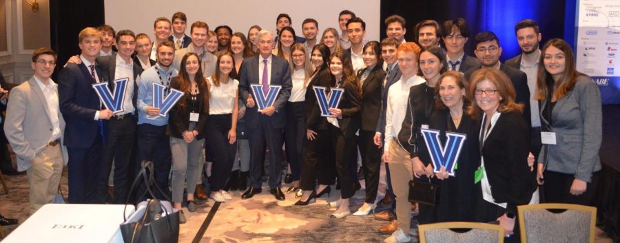 Federal Reserve Chairman Jerome Powell poses with students at the 38th annual NABE Conference.
