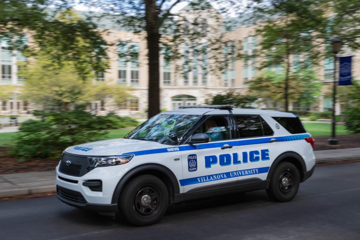 A public safety vehicle driving through campus.