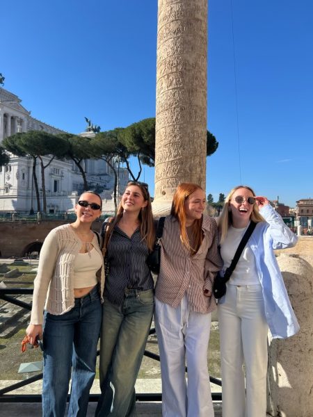 Girls pose for a picture in Italy.
