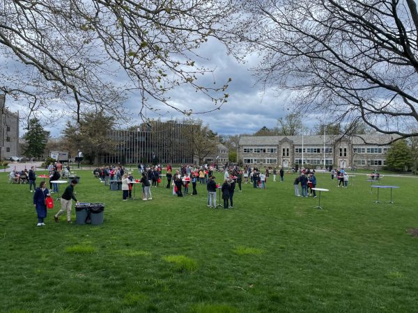 Admitted students and their families enjoy complementary Wawa on Mendel Field during the day.
