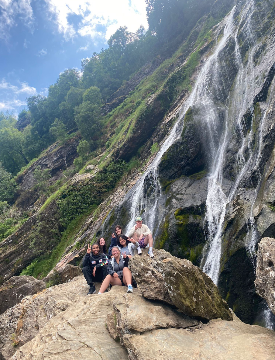 A group of Villanova students, including Natalie, under a waterfall in Ireland.