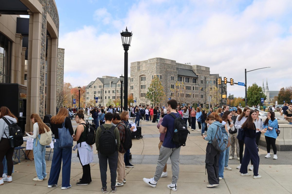 Students wait in line to cast their vote.