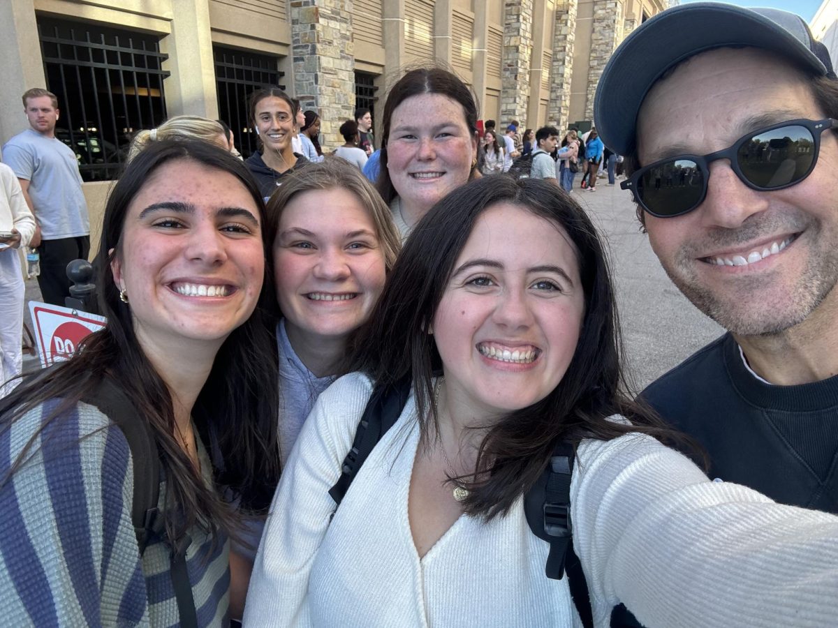 Students meet Paul Rudd while waiting to vote.