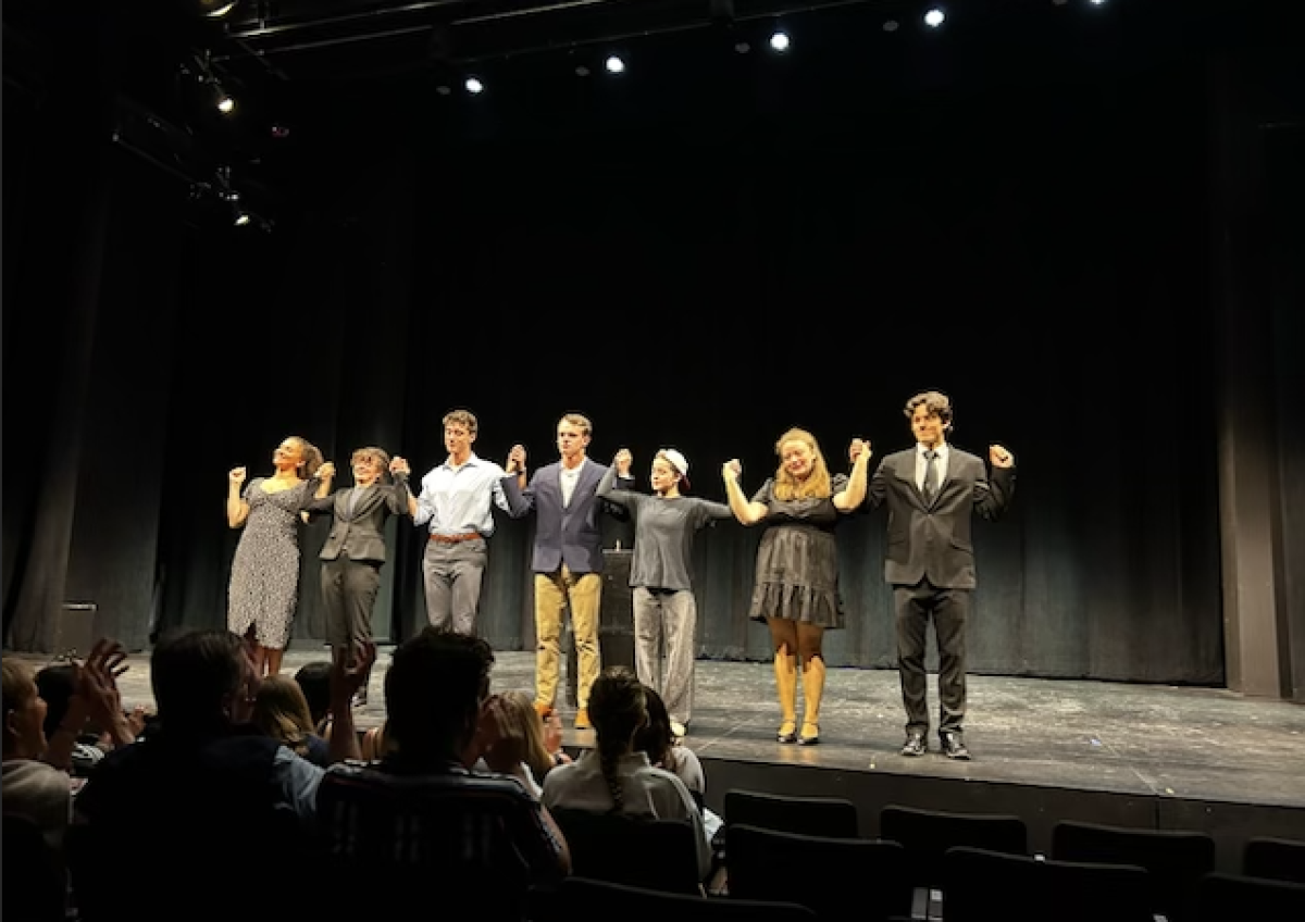 The cast members looked on proudly as the audience cheered them on.